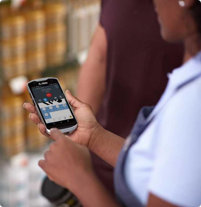 A man looking at here mobile device